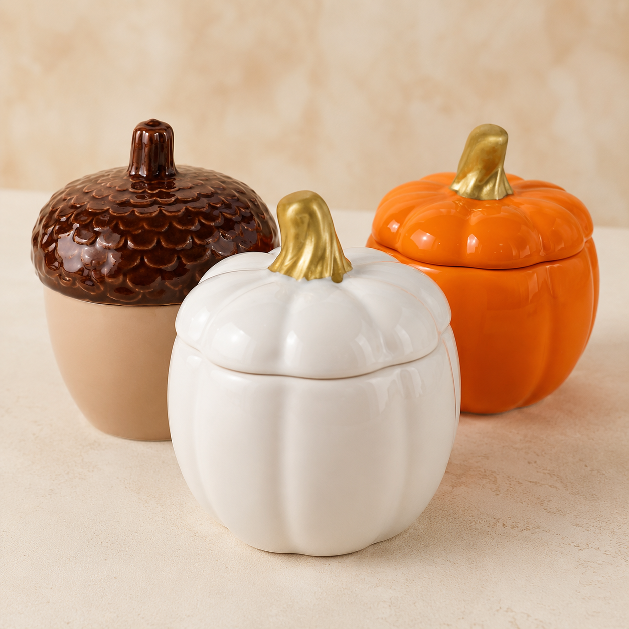 Scents & Gifts fall trinket candles in acorn, white pumpkin, and orange pumpkin ceramic vessels