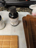 Chocolate bite wax melts with brown and ivory marbling and champagne mica