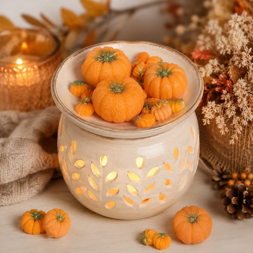 Caramel Pumpkin Swirl pumpkin wax melts in a cozy autumn wax warmer setting