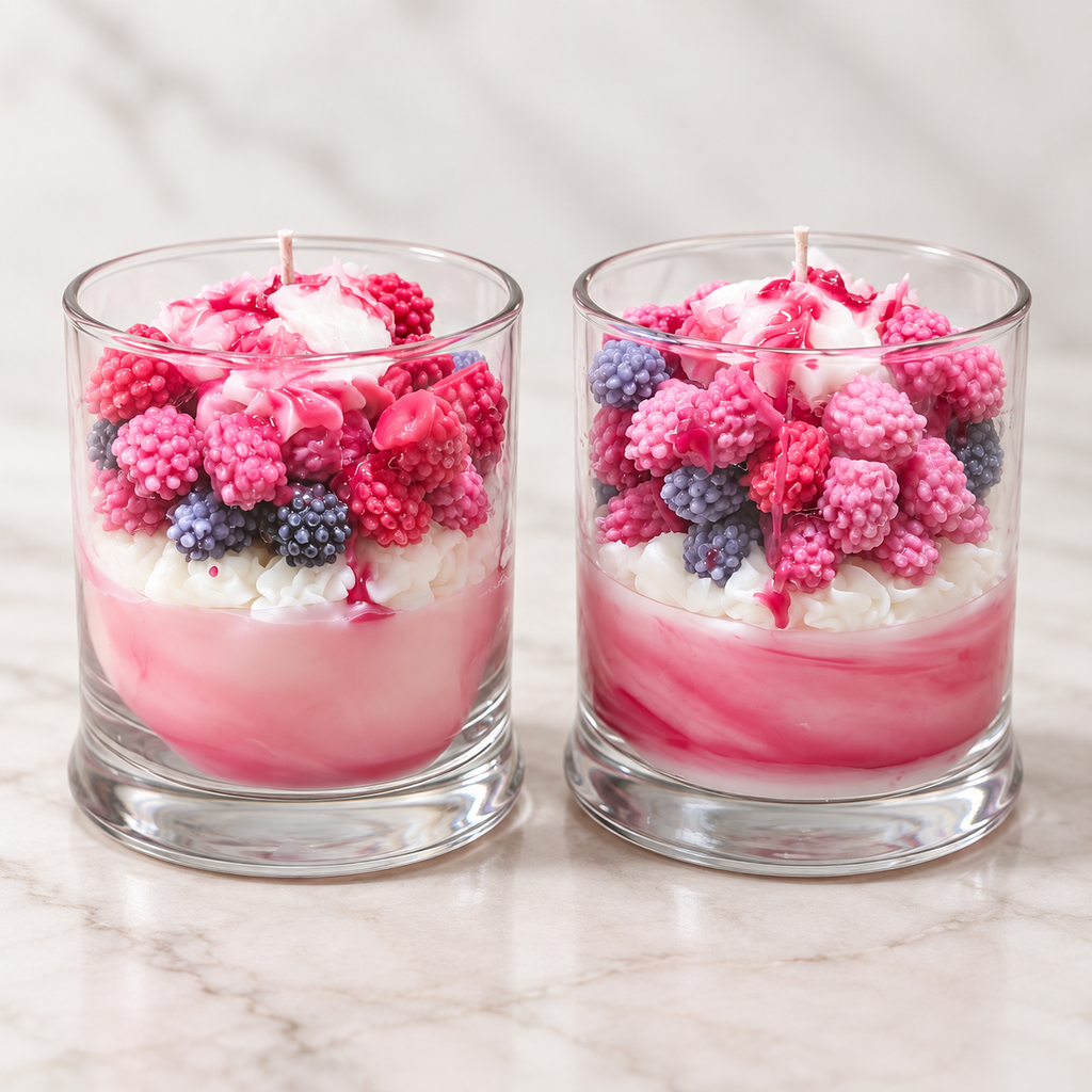 Two hyper-realistic raspberry vanilla berry parfait candles by Scents & Gifts