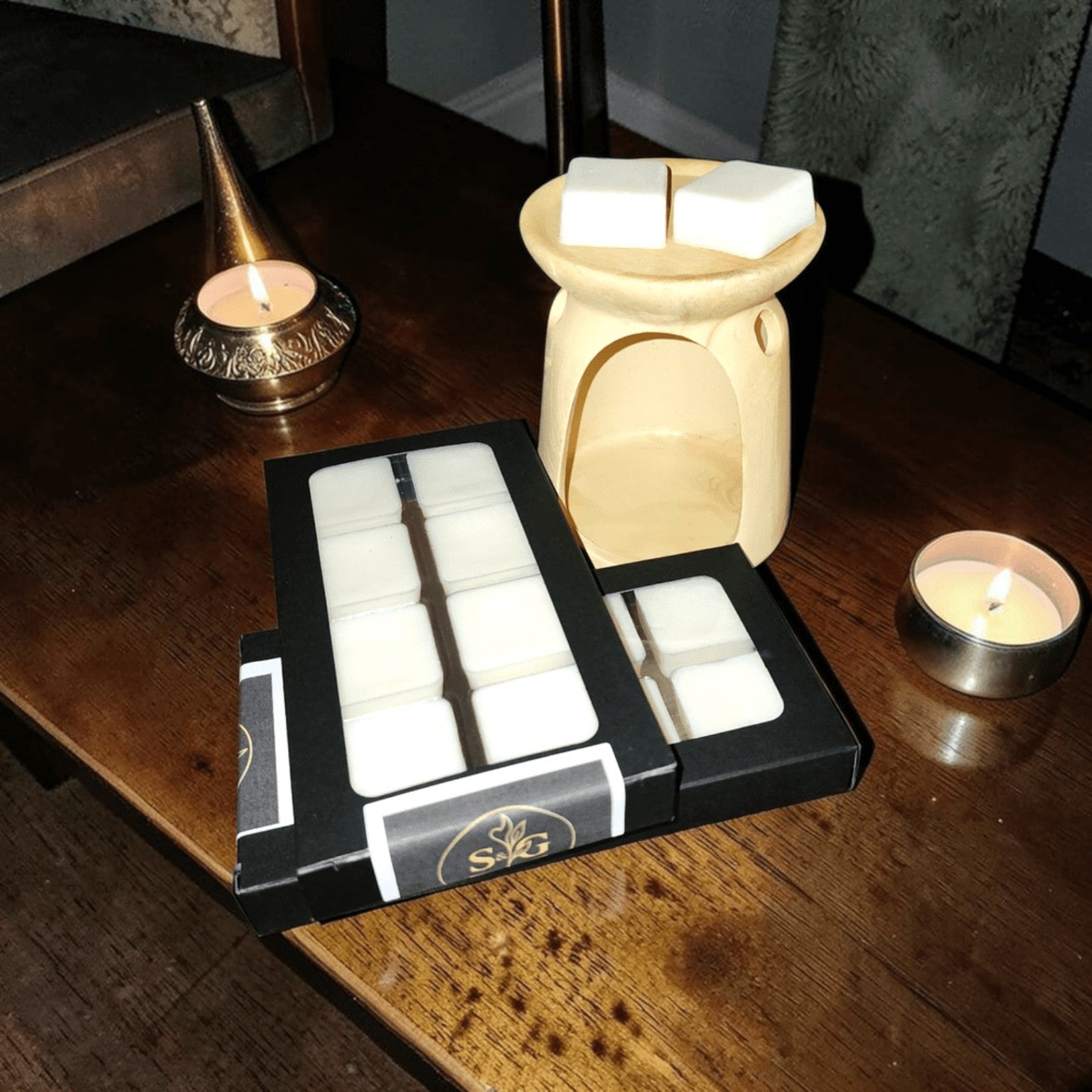 Simply Soy Wax Melts by Scents & Gifts displayed with a wax warmer
