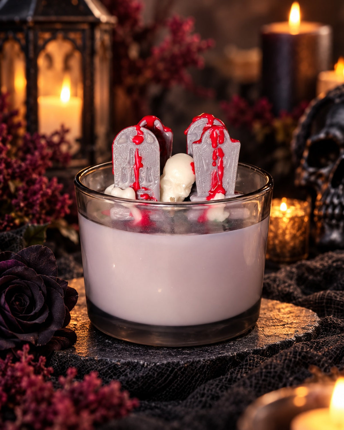 The Boneyard Halloween candle by Scents & Gifts with tombstone and skull wax embeds